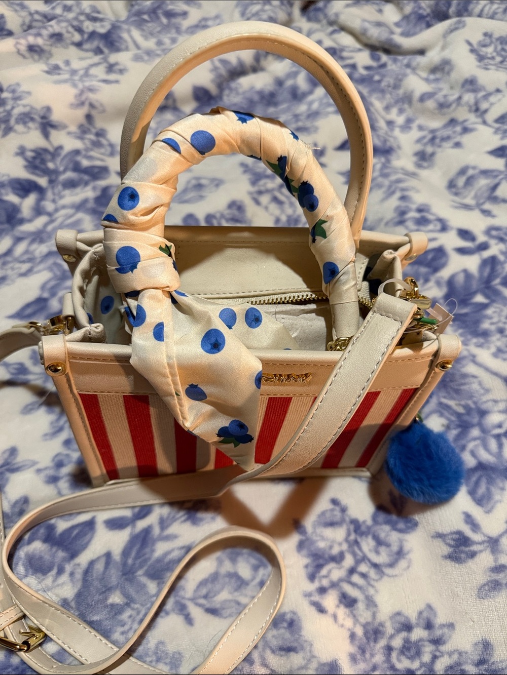 Betsey Johnson Cream and Red Striped Women’s Top-Handle Bag with Blue Pom Pom